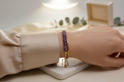 Handmade amethyst bracelet with 24k gold plated Miyuki Delica beads displayed on a marble surface by Gem N Glow by Natali