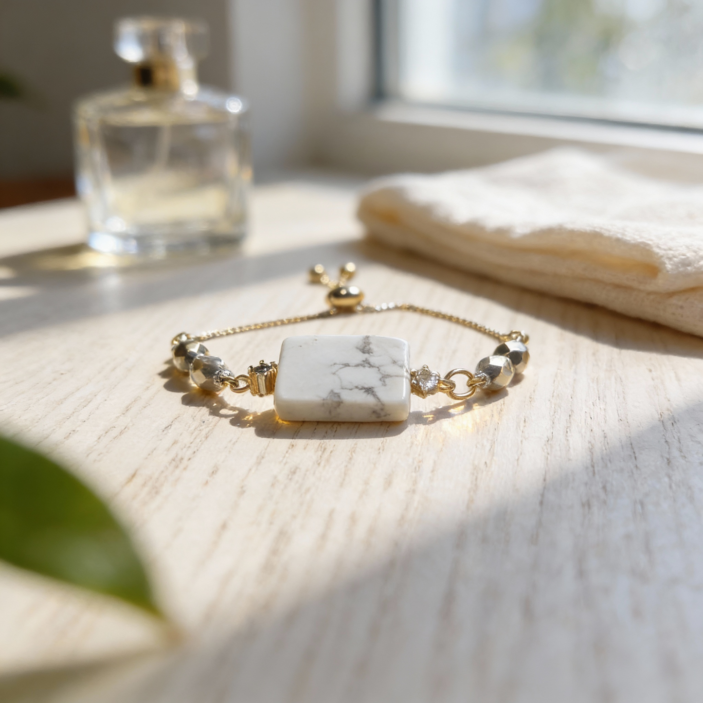 Handmade howlite bracelet with white rectangular stone, gold-tone chain and clear accent beads